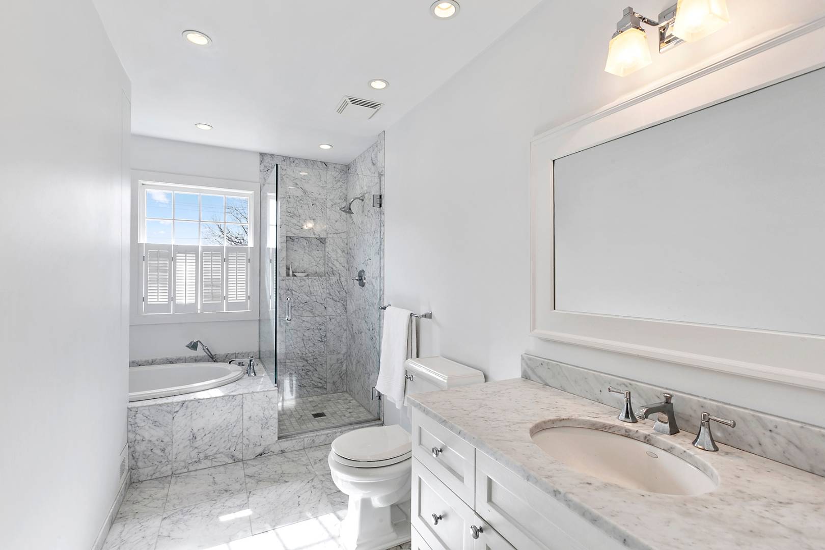 761 North Sea Mecox Road Southampton, NY 11968 - Photo 18 of 22 a bathroom with a granite countertop toilet a sink and a large mirror