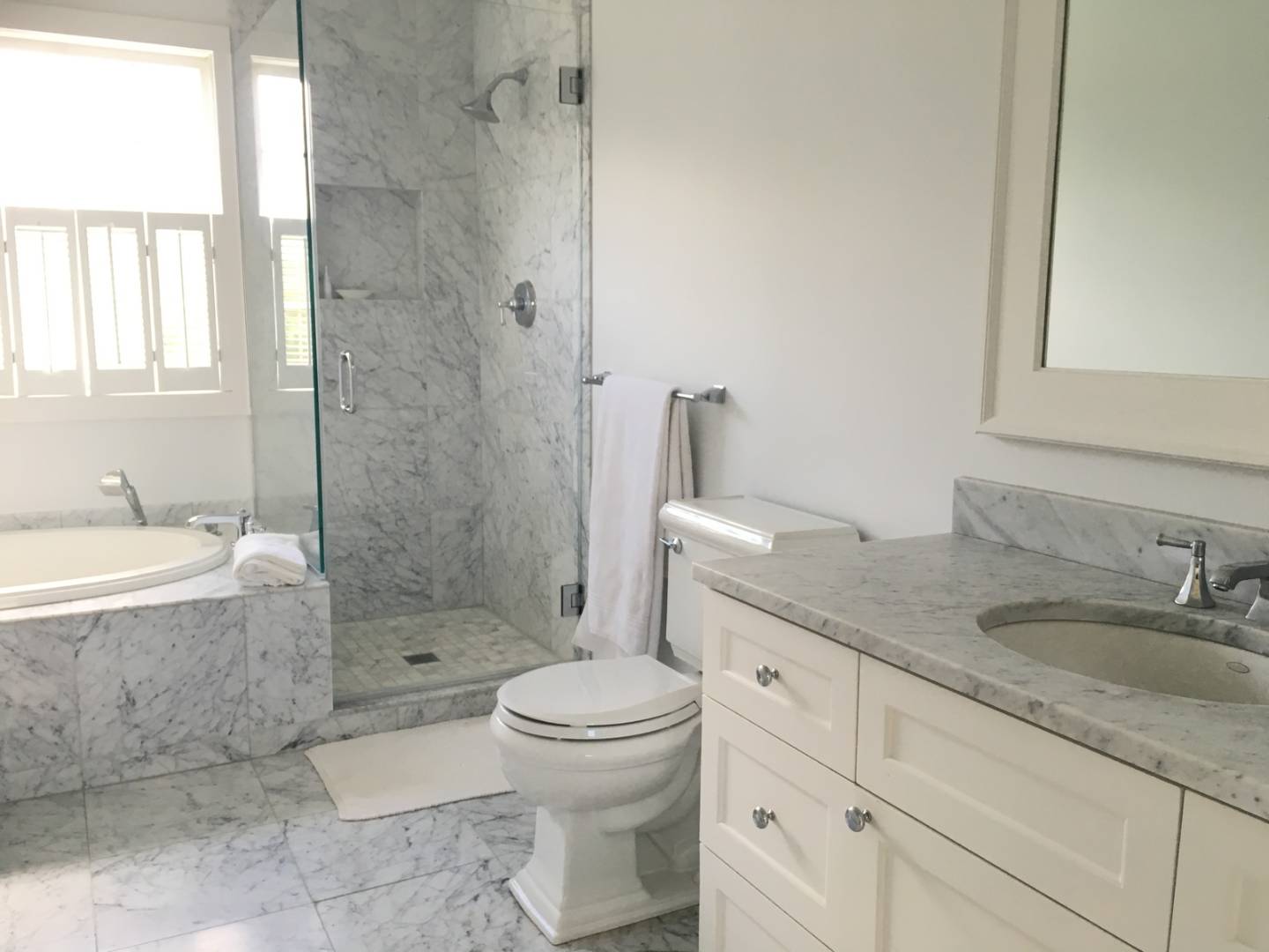 761 North Sea Mecox Road Southampton, NY 11968 - Photo 20 of 22 a bathroom with a granite countertop toilet a sink and a bathtub
