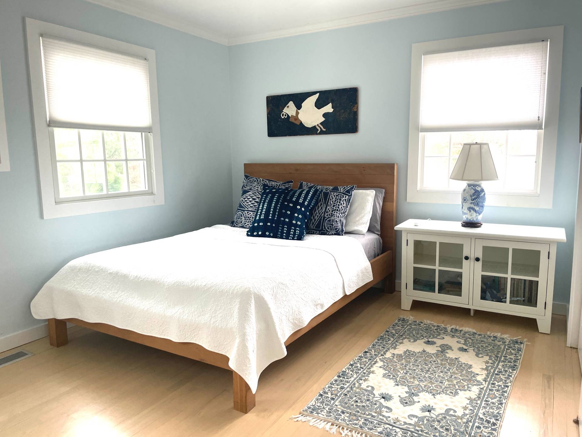 761 North Sea Mecox Road Southampton, NY 11968 - Photo 21 of 22 a large bed sitting in a bedroom next to a window