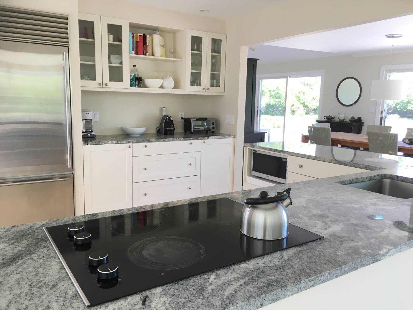 761 North Sea Mecox Road Southampton, NY 11968 - Photo 8 of 22 a kitchen with a stove a refrigerator and a counter top space
