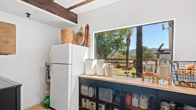 a kitchen with a refrigerator and a sink