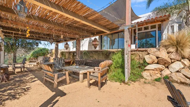 a view of a terrace with furniture