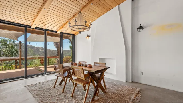 a view of a dining room with furniture window and outside view