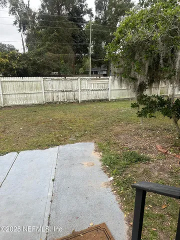 a view of swimming pool with a yard