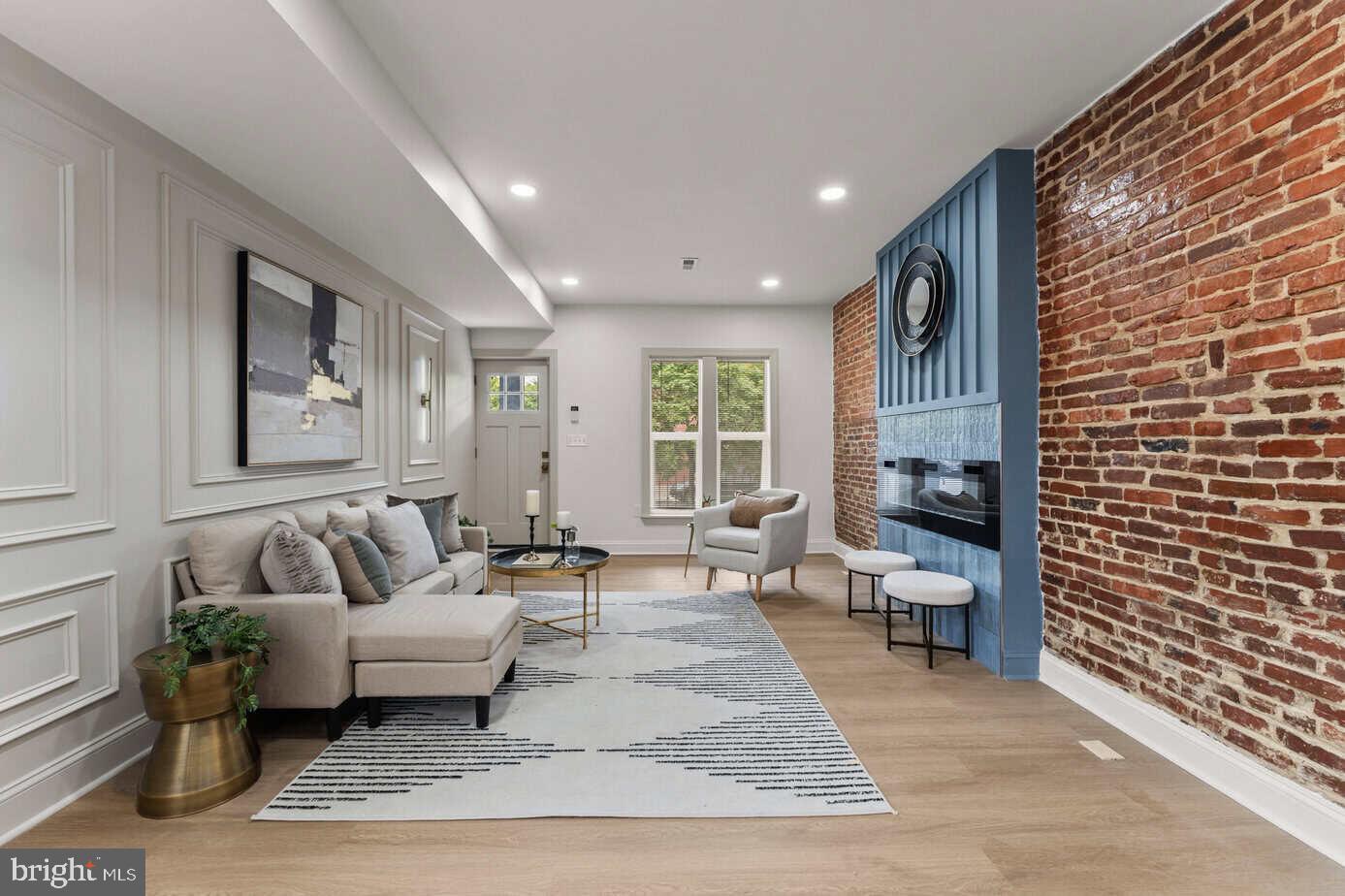 3121 McElderry Street Baltimore, MD 21205 - Photo 5 of 25 Living Room / Brick Accent Wall