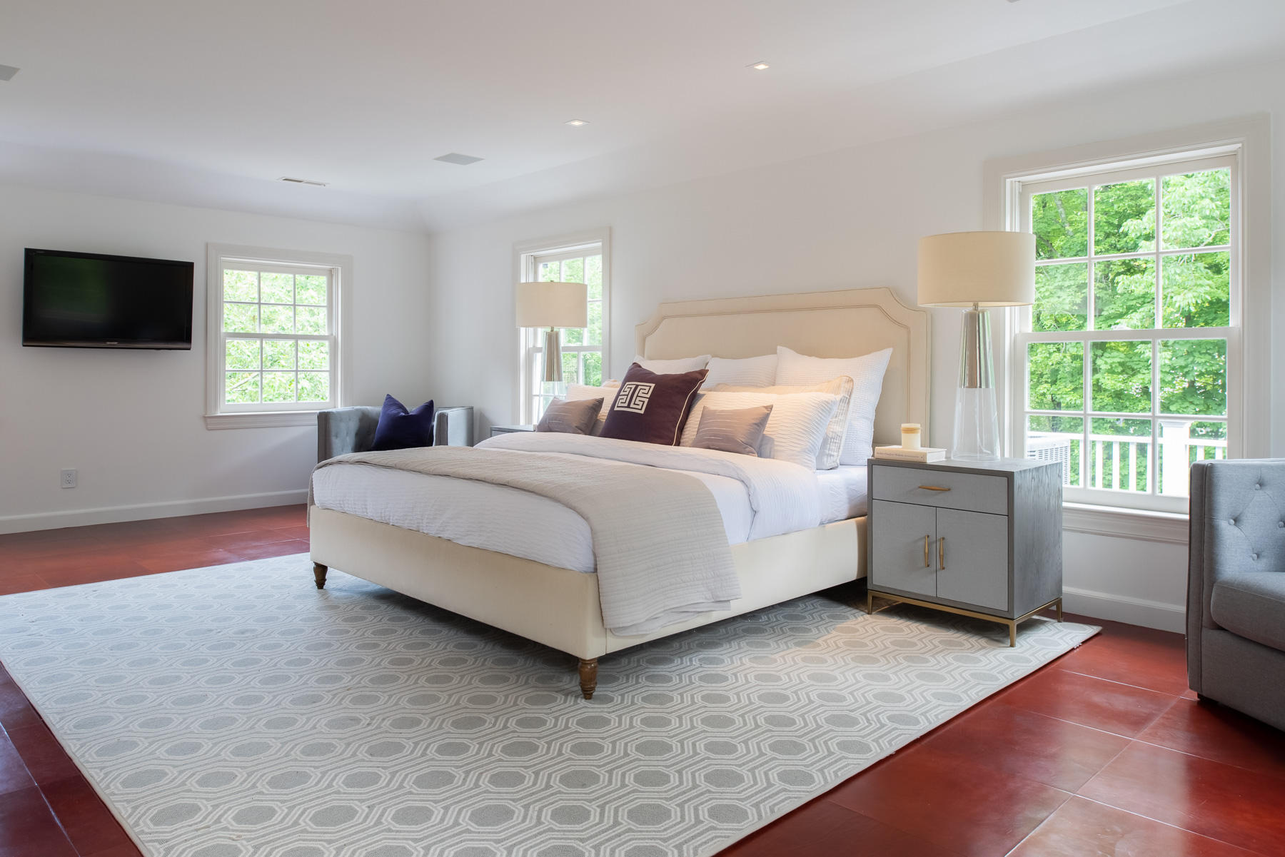 20 St Nicholas Road Darien, CT 06820 - Photo 24 of 38 a bedroom with a bed and a flat screen tv