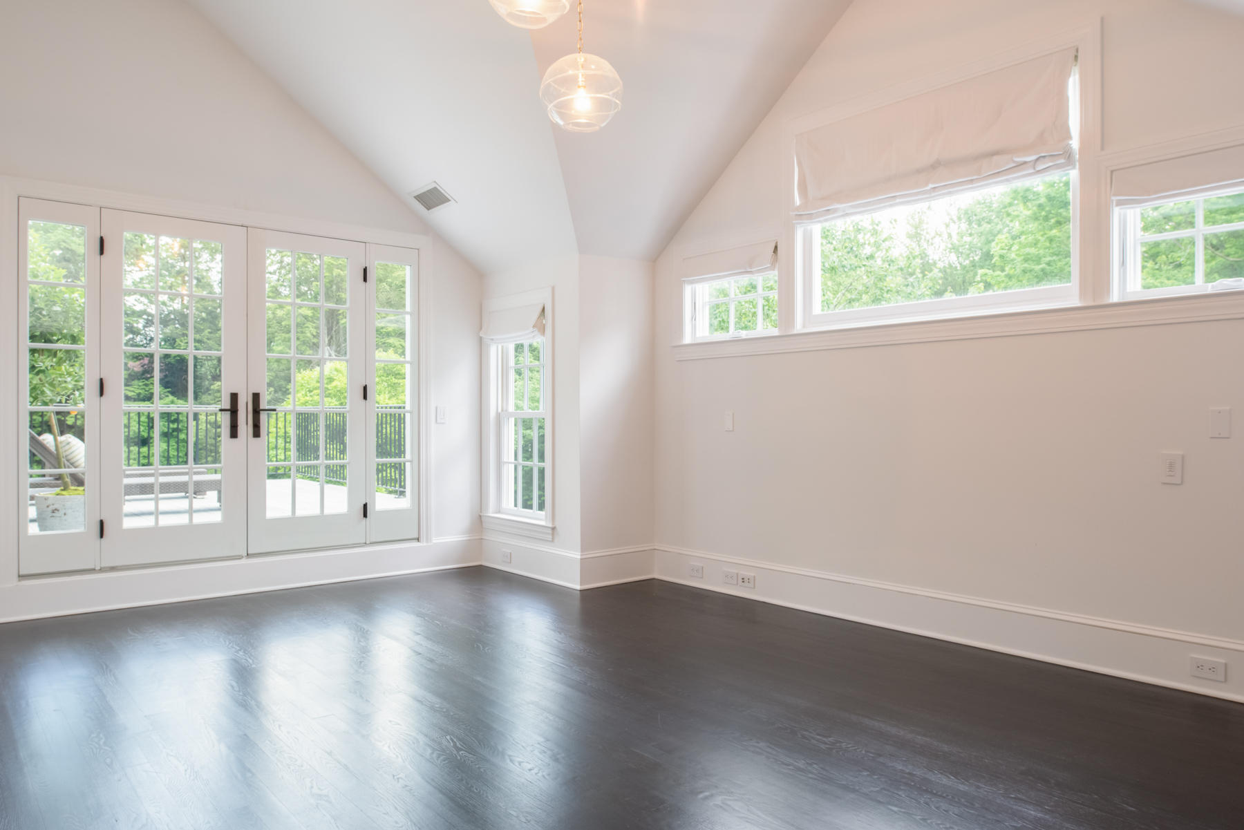 20 St Nicholas Road Darien, CT 06820 - Photo 28 of 38 a view of wooden floor and windows in a room