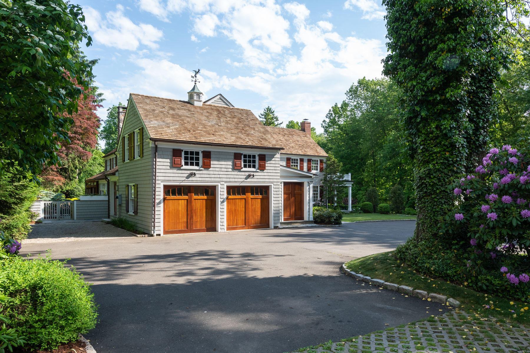 20 St Nicholas Road Darien, CT 06820 - Photo 36 of 38 a front view of a house with a yard