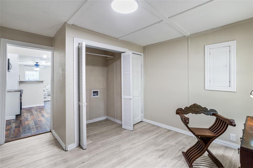 614 Rice Street Denison, TX 75020 - Photo 17 of 22 The laundry room is at the back of the house, but it also has room for a good office area 0r possibly a pantry area.