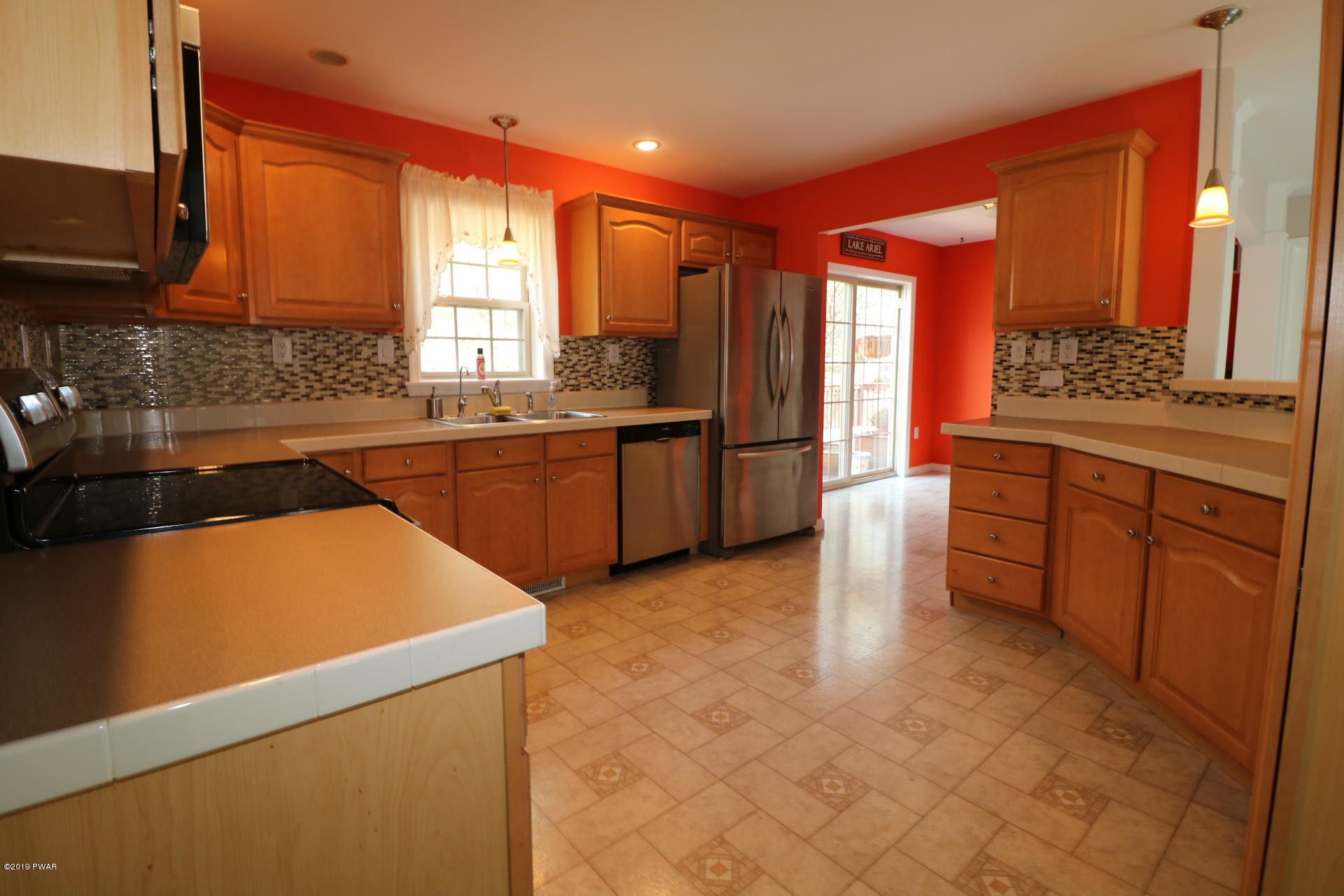 1271 Brookfield Road Lake Ariel, PA 18436 - Photo 15 of 143 a large kitchen with stainless steel appliances granite countertop a sink counter space and a large window