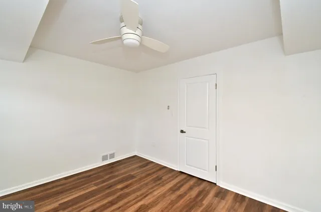 a bathroom with a sink vanity granite and a mirror
