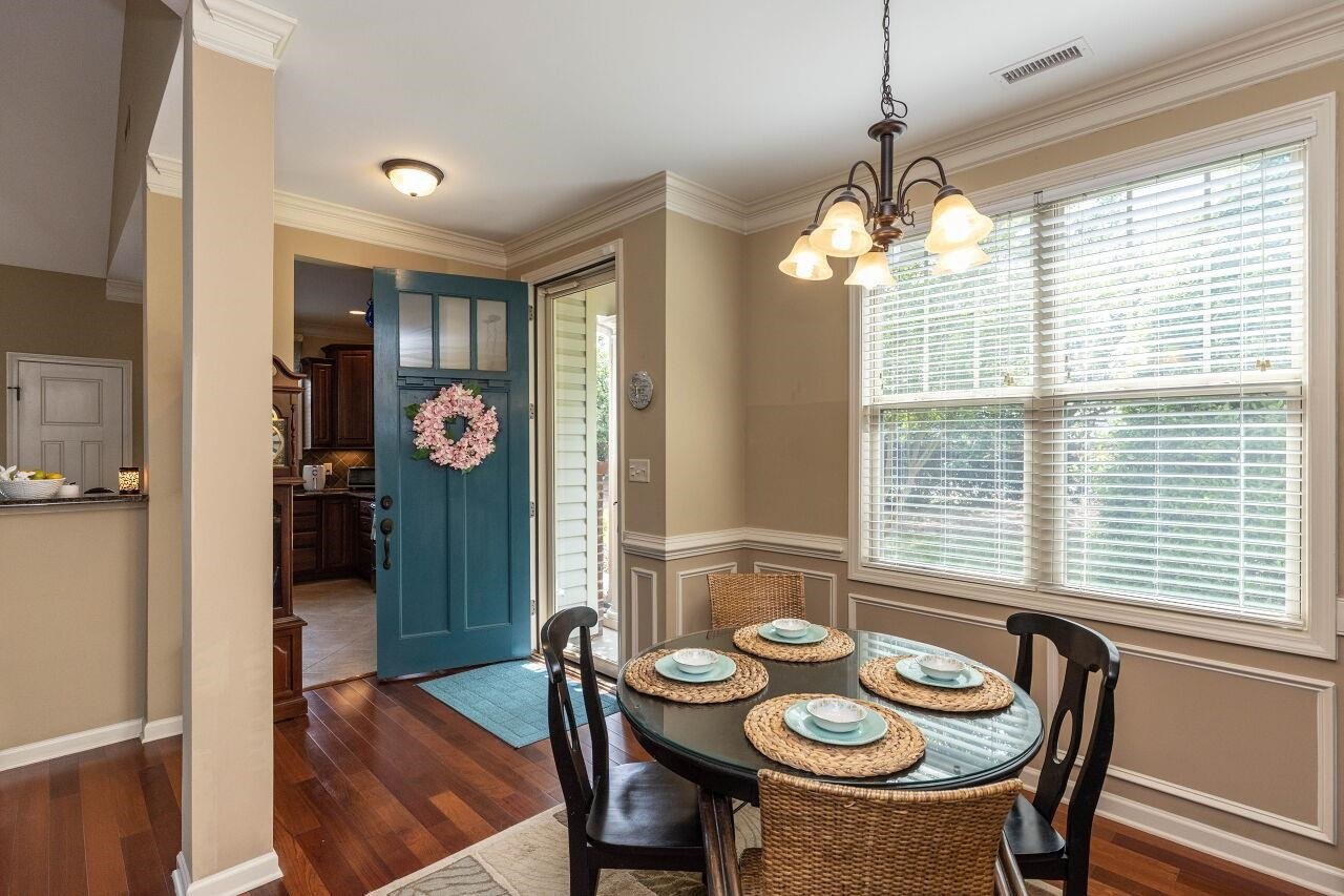 5 Crosby Lane Garner, NC 27529 - Photo 5 of 30 a view of a dining room with furniture window and wooden floor