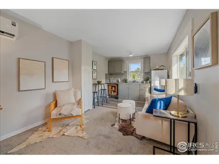 a kitchen with refrigerator cabinets and wooden floor