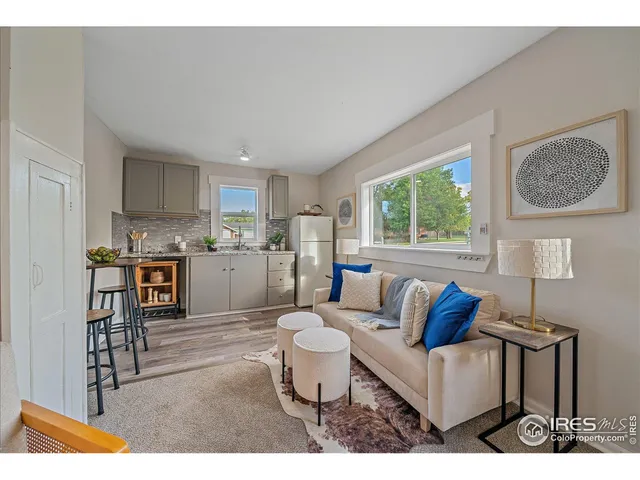 a bathroom with a sink mirror and shower