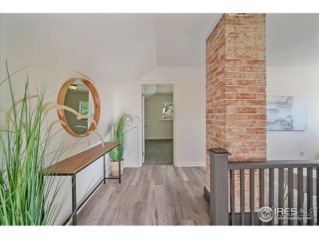 a view of entryway with wooden floor