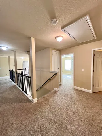 a lobby with furniture and window