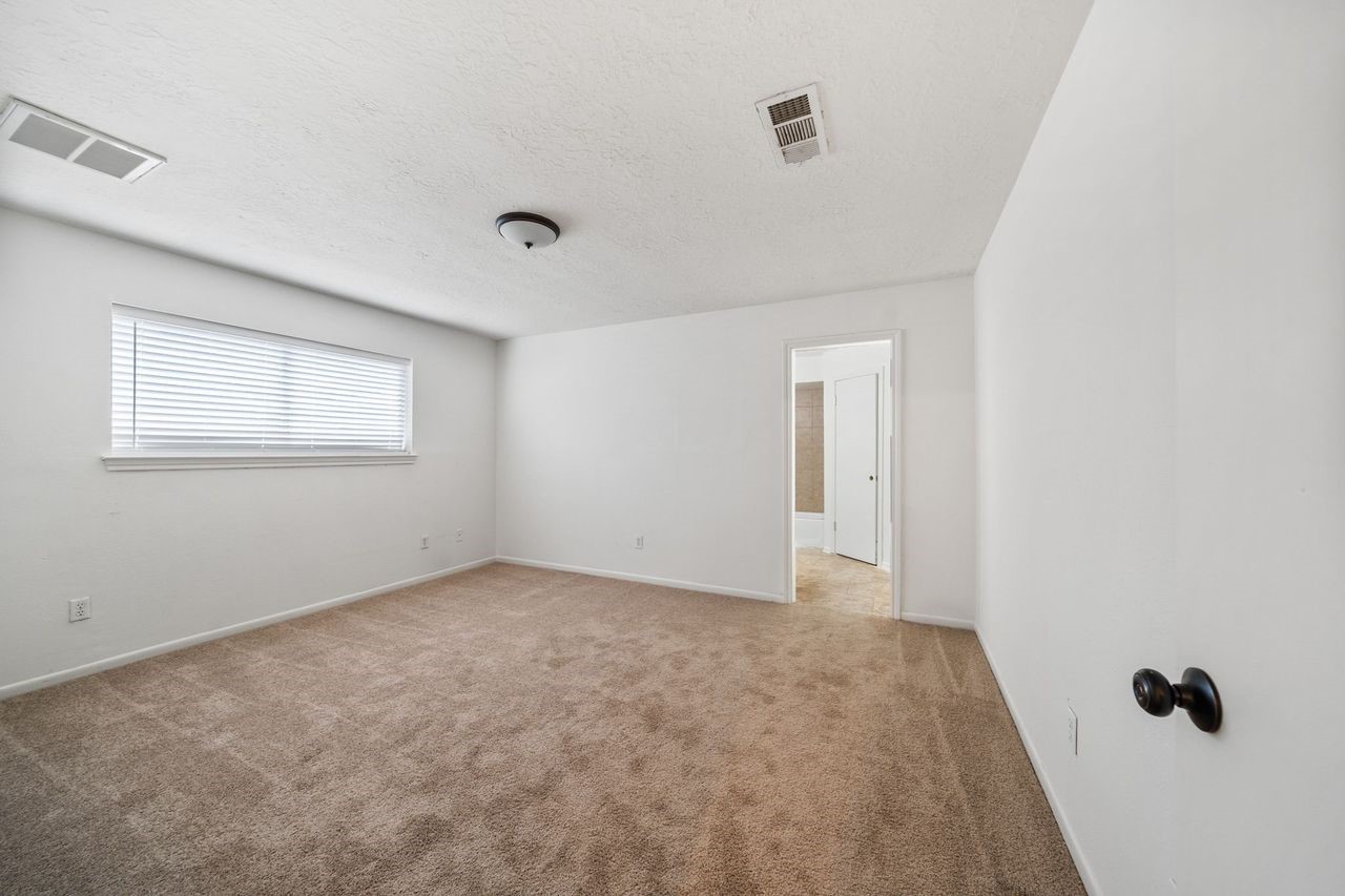 8 Flint Street Conroe, TX 77301 - Photo 12 of 21 Primary Bedroom