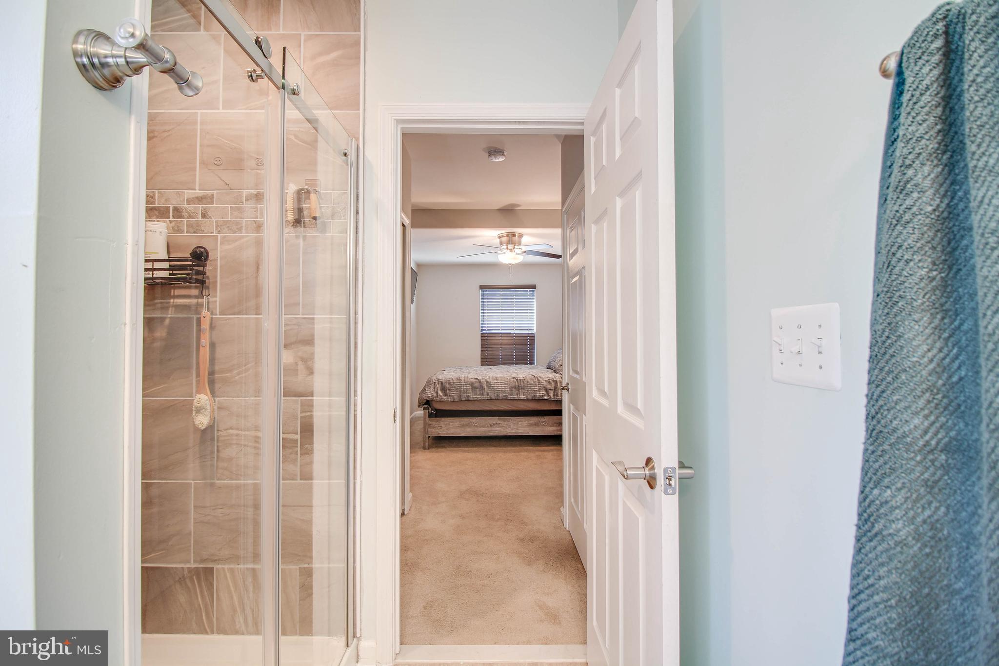 7805 Outing Avenue Pasadena, MD 21122 - Photo 14 of 51 a en suite bathroom with a shower