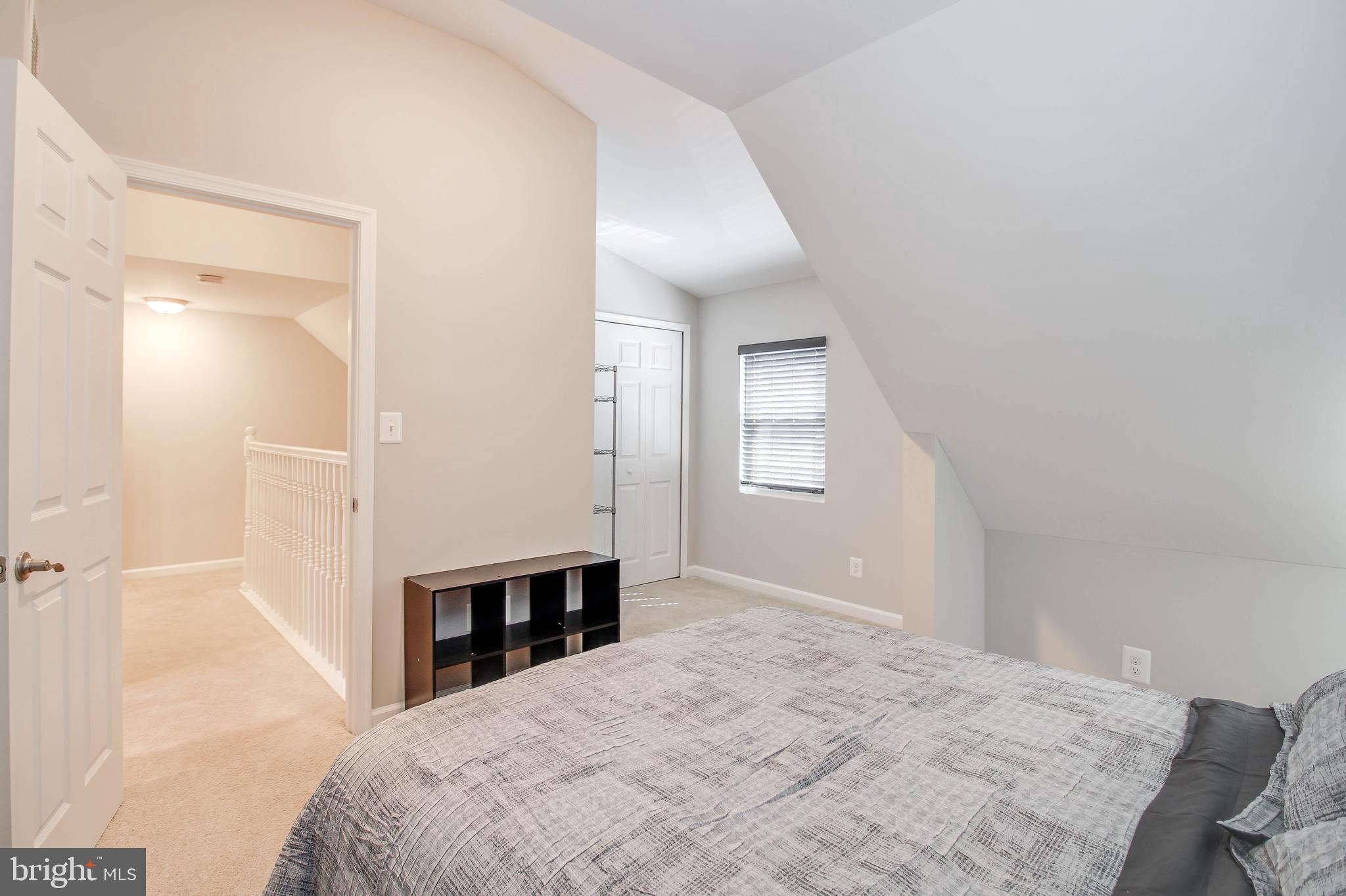 7805 Outing Avenue Pasadena, MD 21122 - Photo 21 of 51 a bedroom with a bed and a window