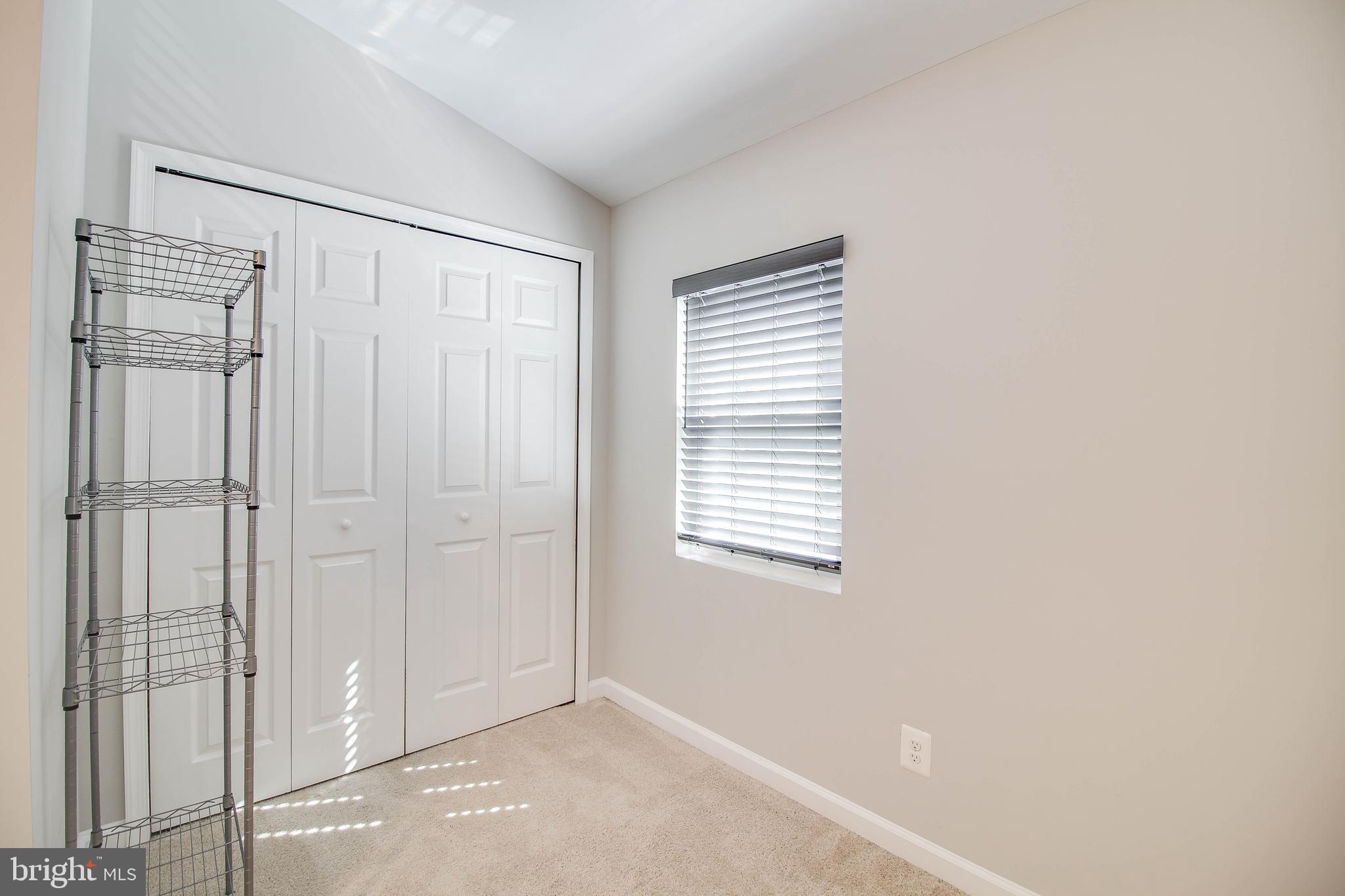 7805 Outing Avenue Pasadena, MD 21122 - Photo 22 of 51 a view of an empty room with a window