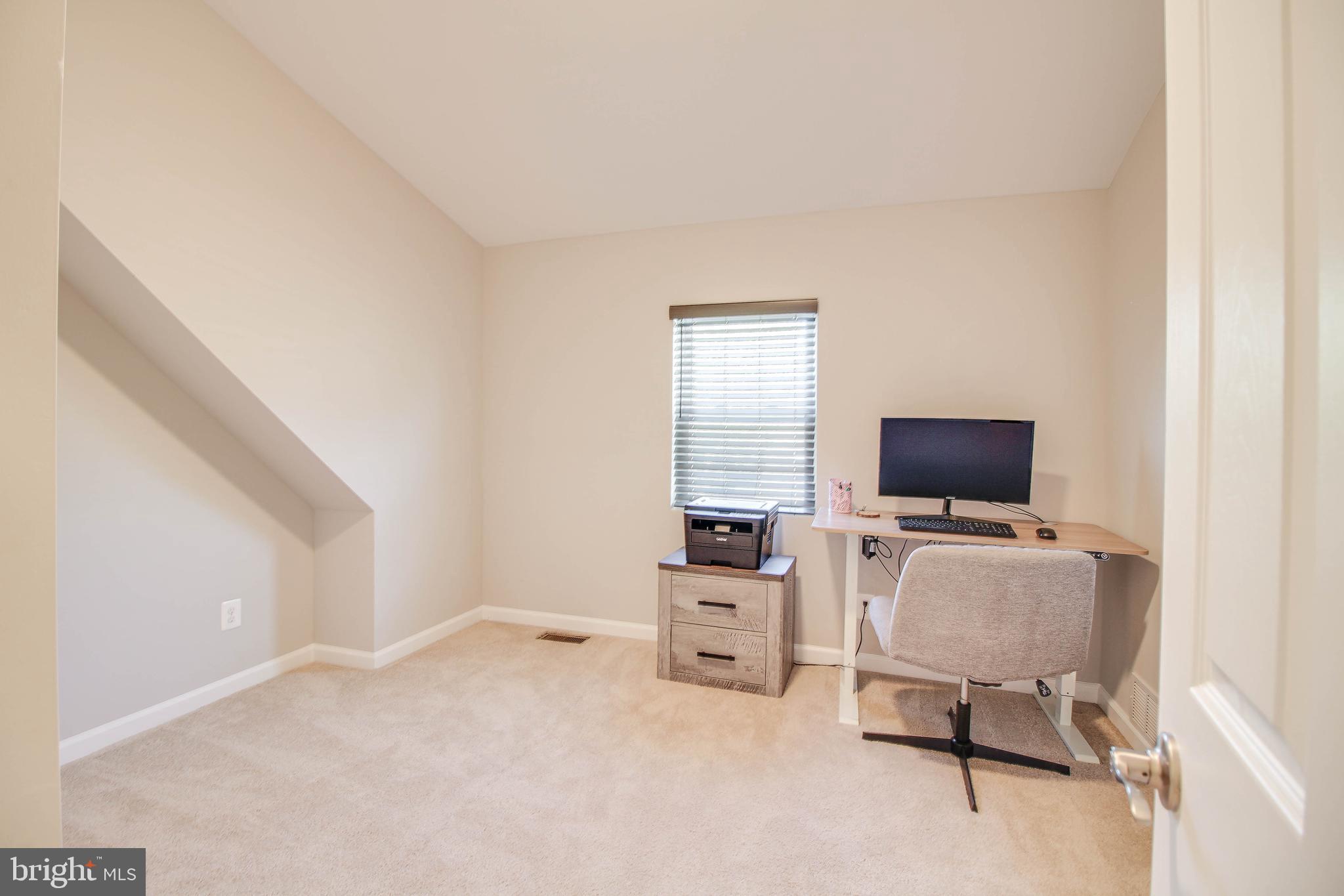 7805 Outing Avenue Pasadena, MD 21122 - Photo 25 of 51 a livingroom with a flat screen tv and furniture