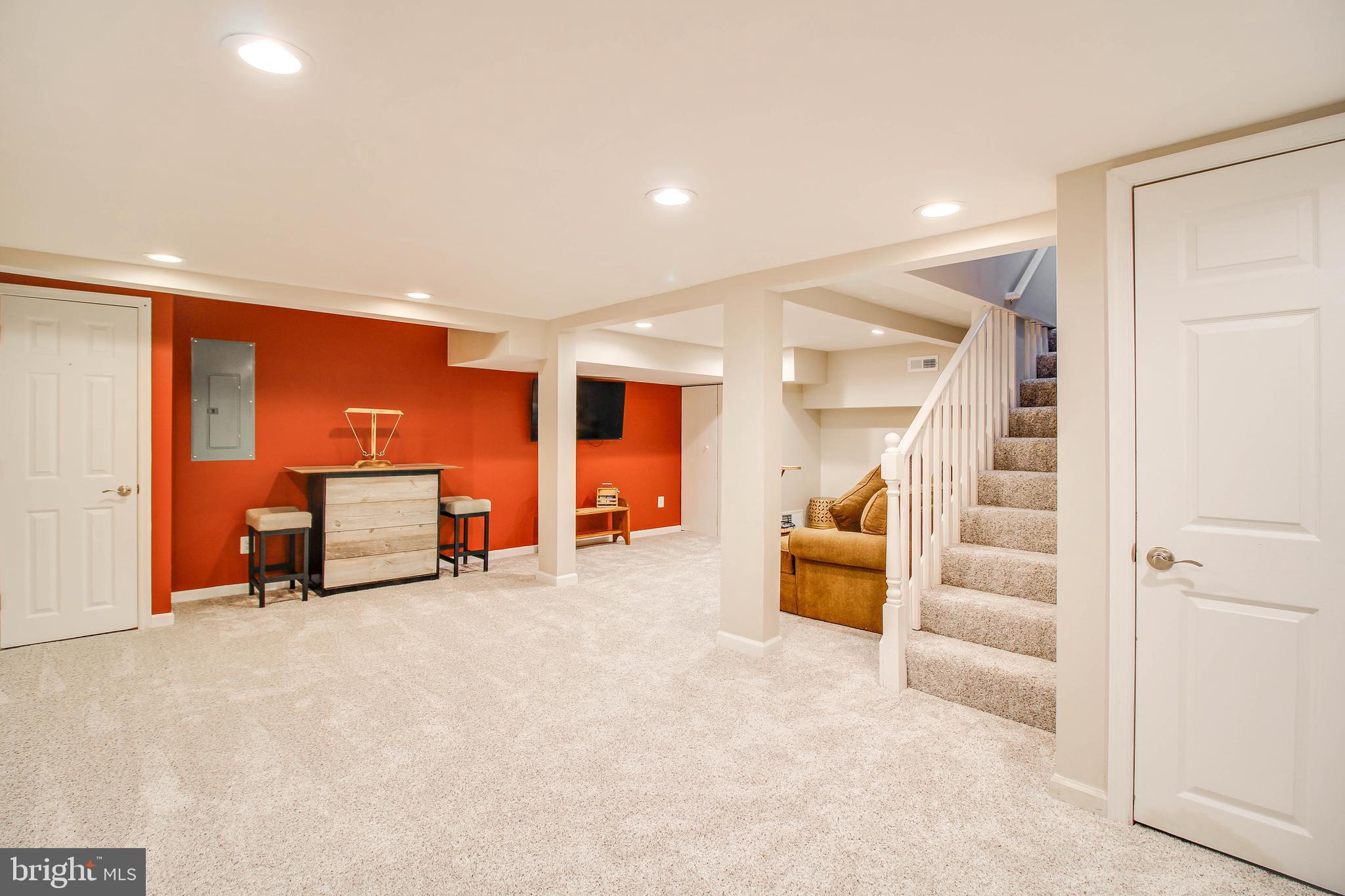 7805 Outing Avenue Pasadena, MD 21122 - Photo 27 of 51 en empty room with a large window and furniture