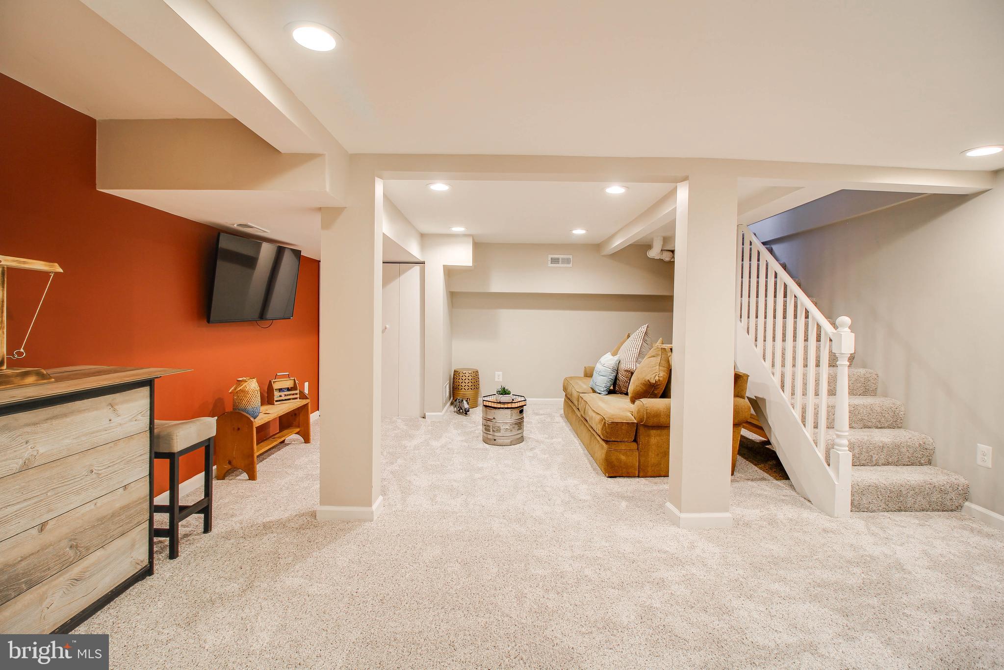 7805 Outing Avenue Pasadena, MD 21122 - Photo 28 of 51 a hallway with seating area