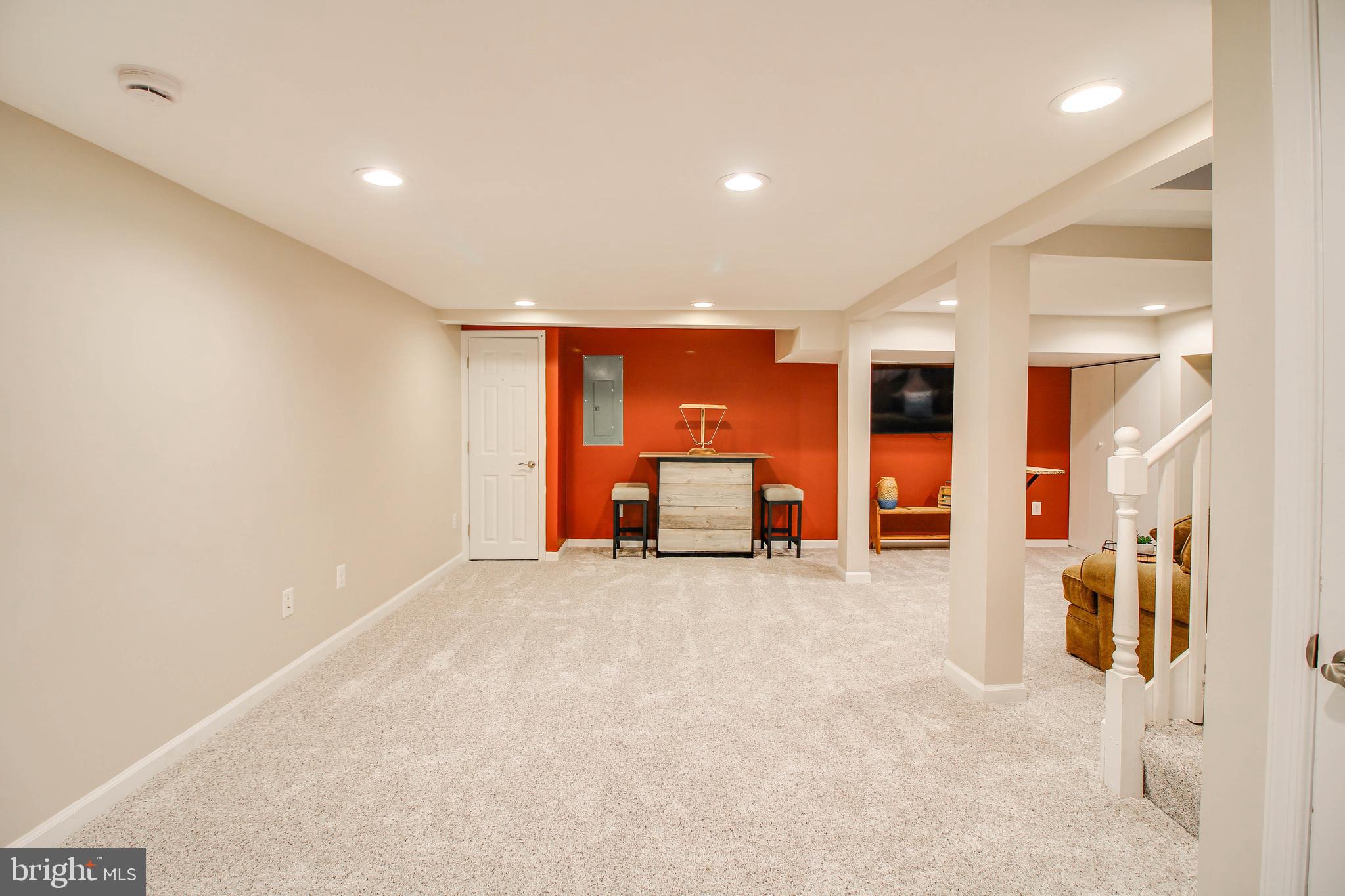 7805 Outing Avenue Pasadena, MD 21122 - Photo 30 of 51 a view of a hall with wooden floor