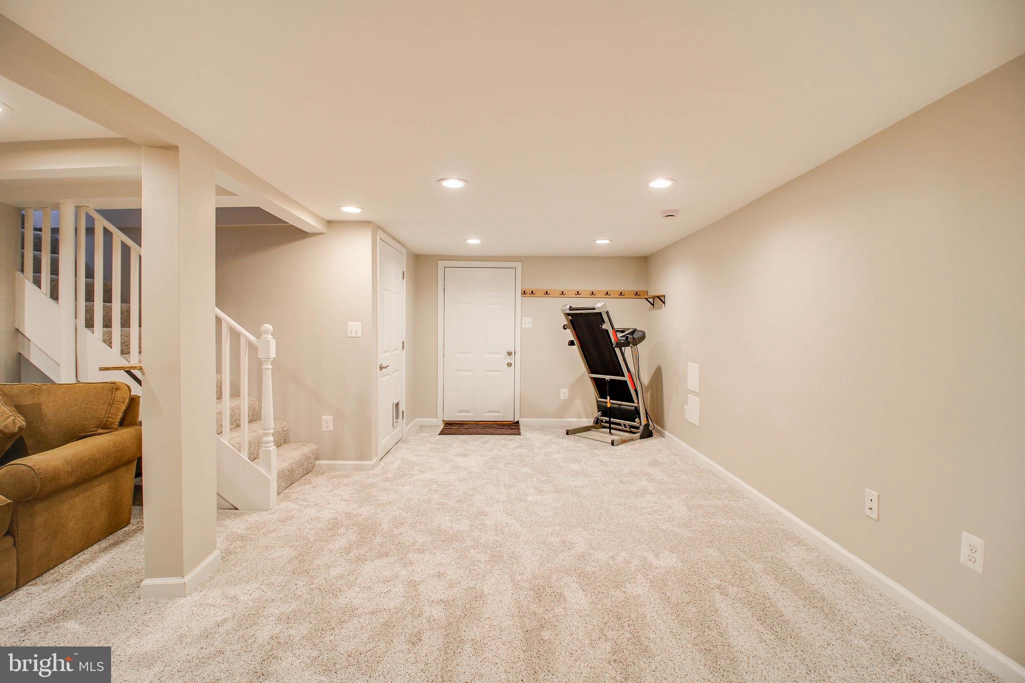 7805 Outing Avenue Pasadena, MD 21122 - Photo 32 of 51 a view of a livingroom with furniture and a ceiling fan