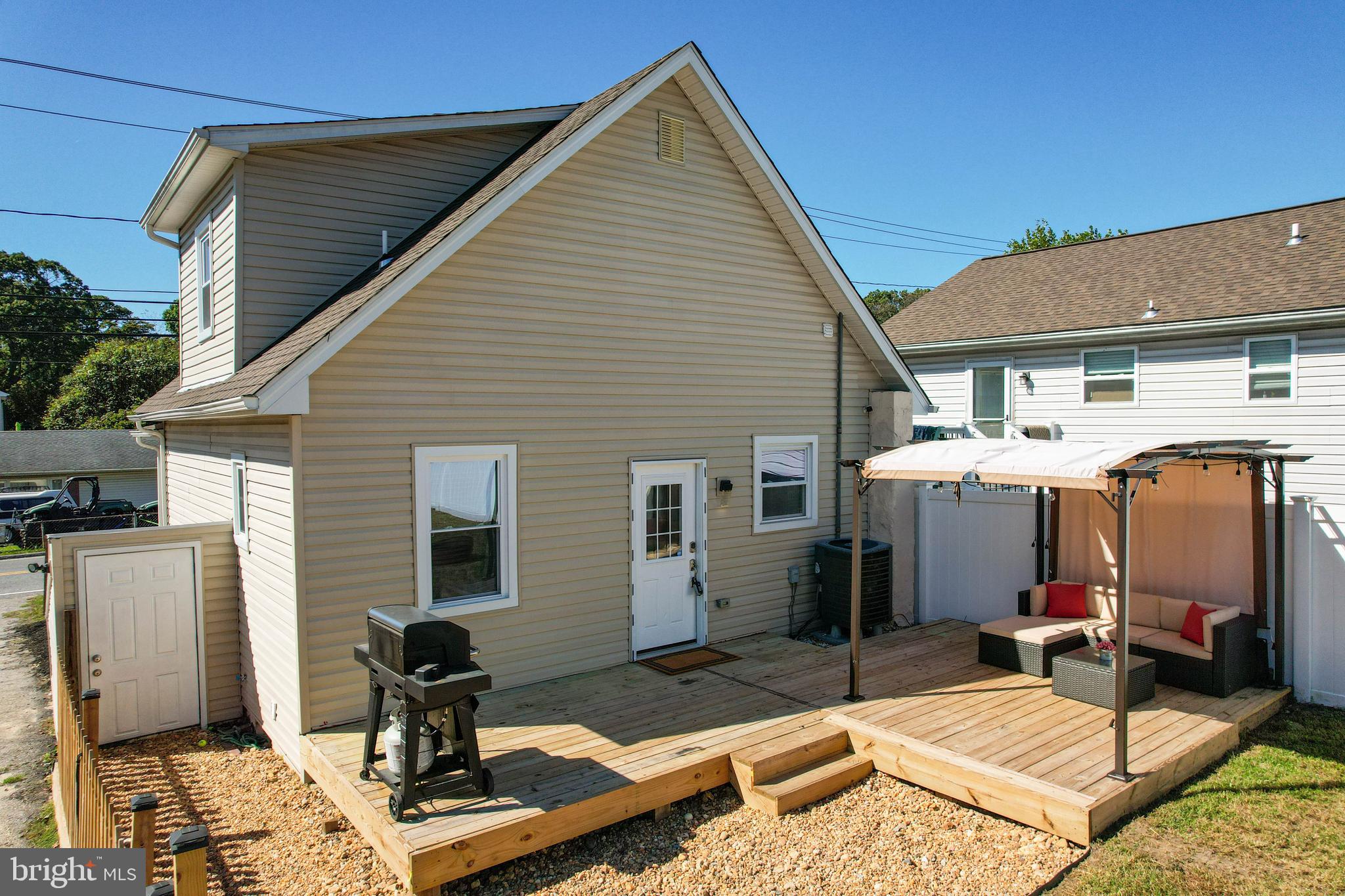 7805 Outing Avenue Pasadena, MD 21122 - Photo 34 of 51 a backyard of a house with yard fire pit and outdoor seating