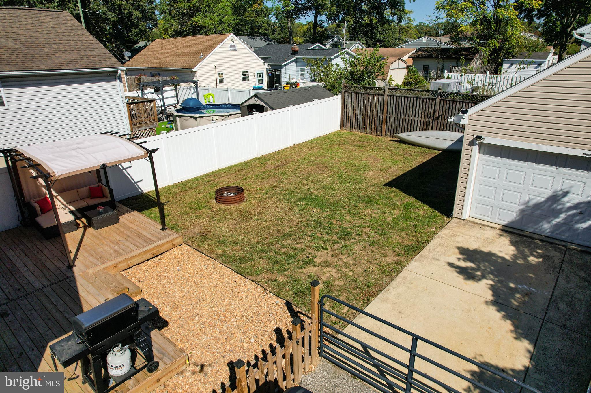 7805 Outing Avenue Pasadena, MD 21122 - Photo 37 of 51 a view of outdoor kitchen and seating area