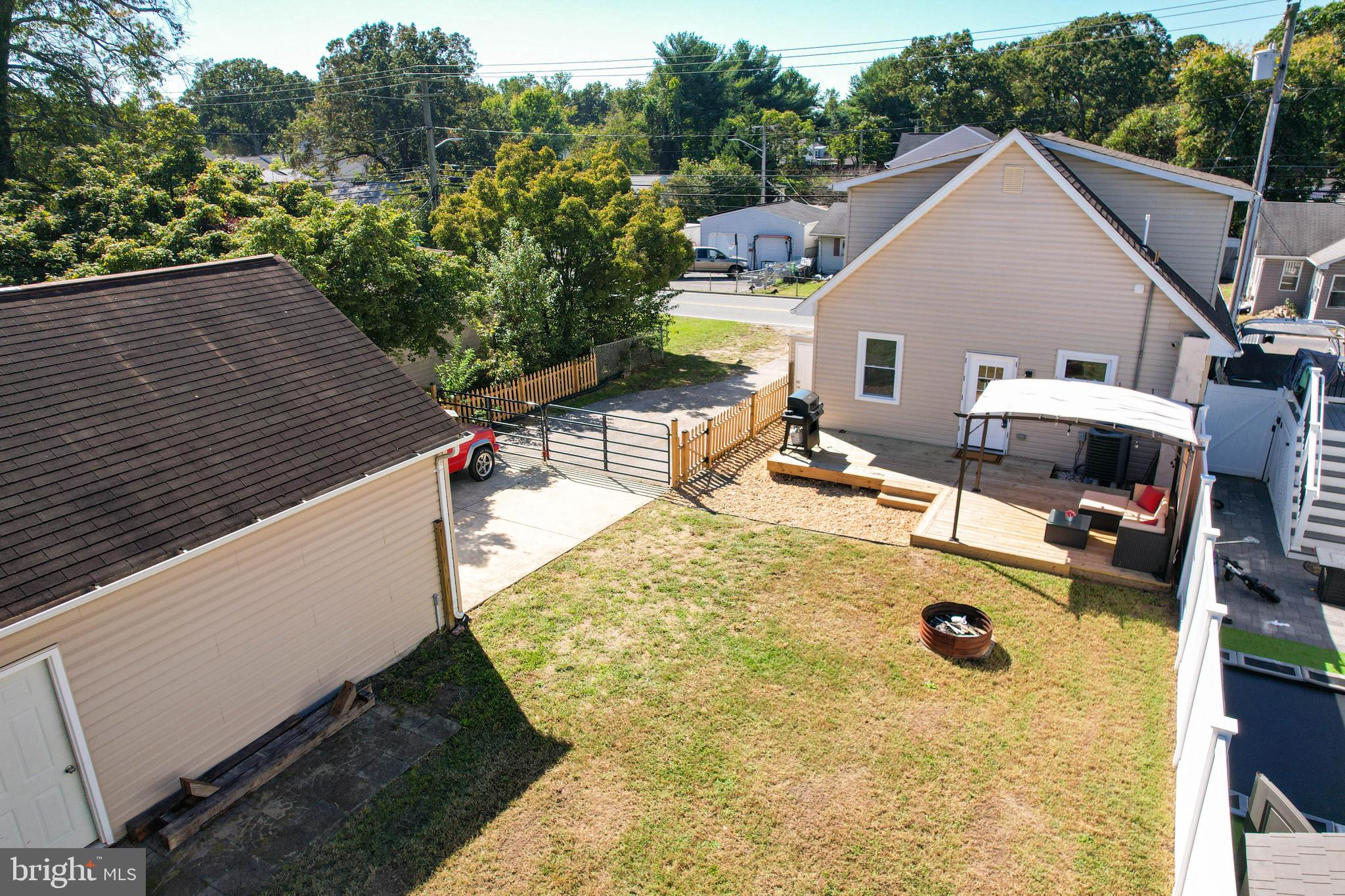 7805 Outing Avenue Pasadena, MD 21122 - Photo 38 of 51 a view of a backyard with a patio