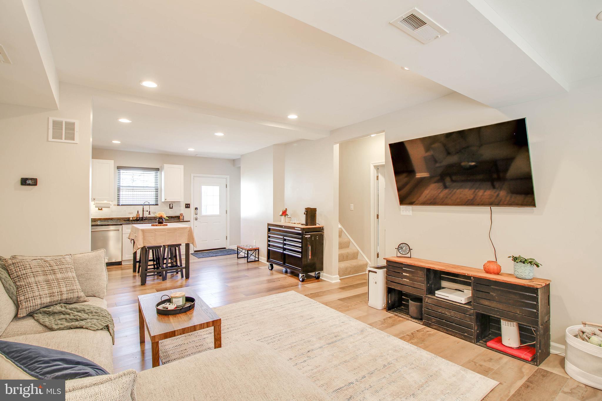 7805 Outing Avenue Pasadena, MD 21122 - Photo 4 of 51 a living room with furniture and a flat screen tv