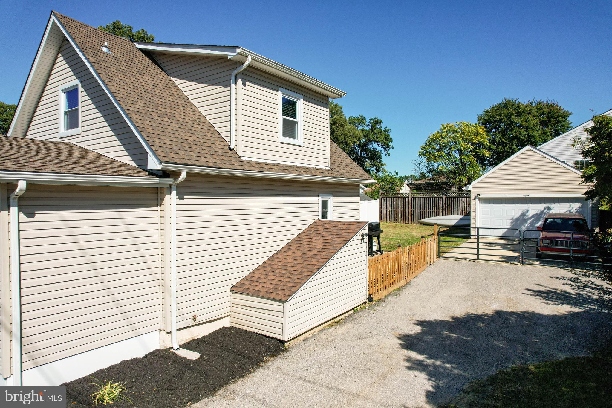 7805 Outing Avenue Pasadena, MD 21122 - Photo 41 of 51 a view of a patio with a table and chairs