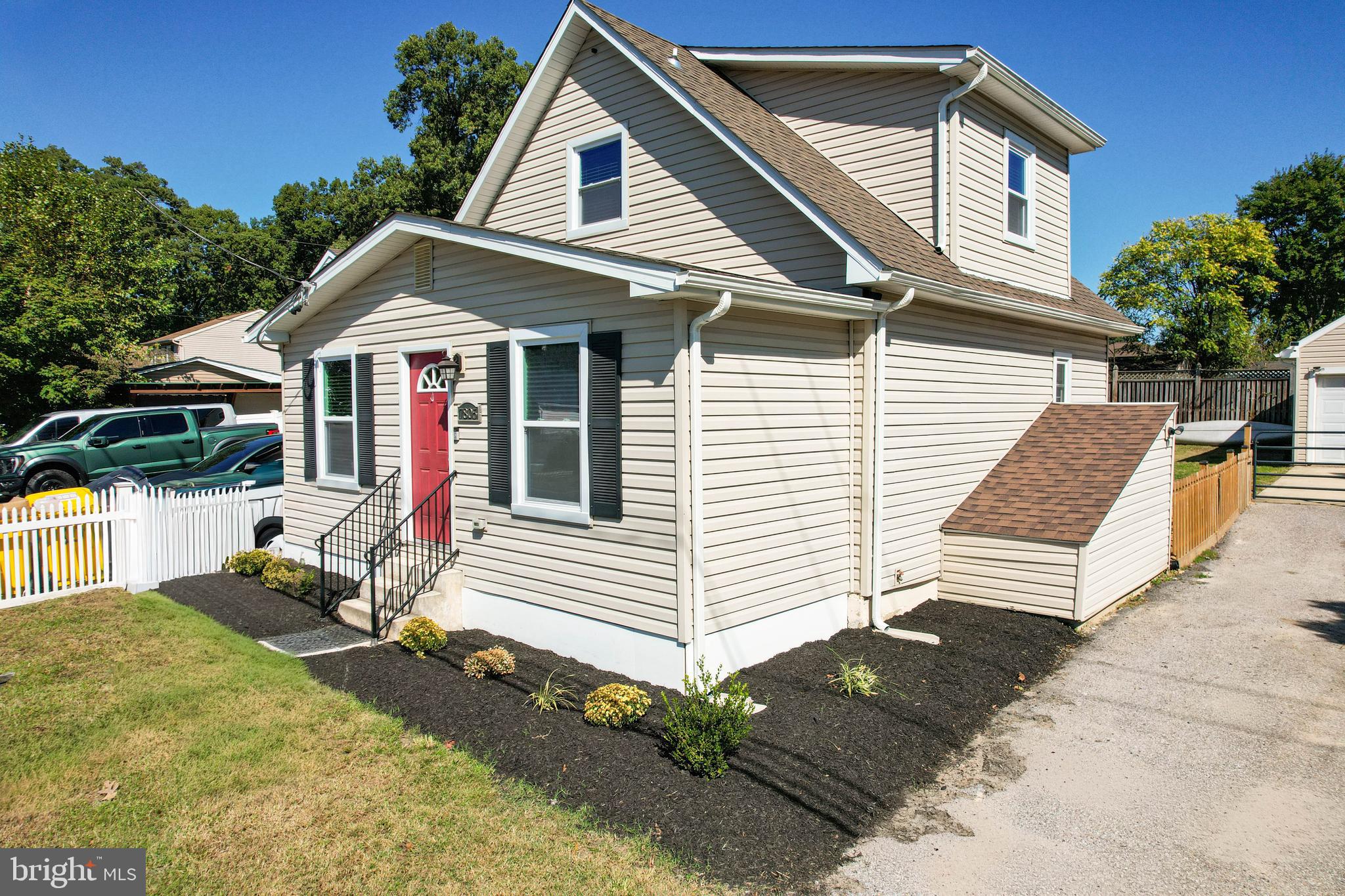 7805 Outing Avenue Pasadena, MD 21122 - Photo 50 of 51 a front view of a house with a yard