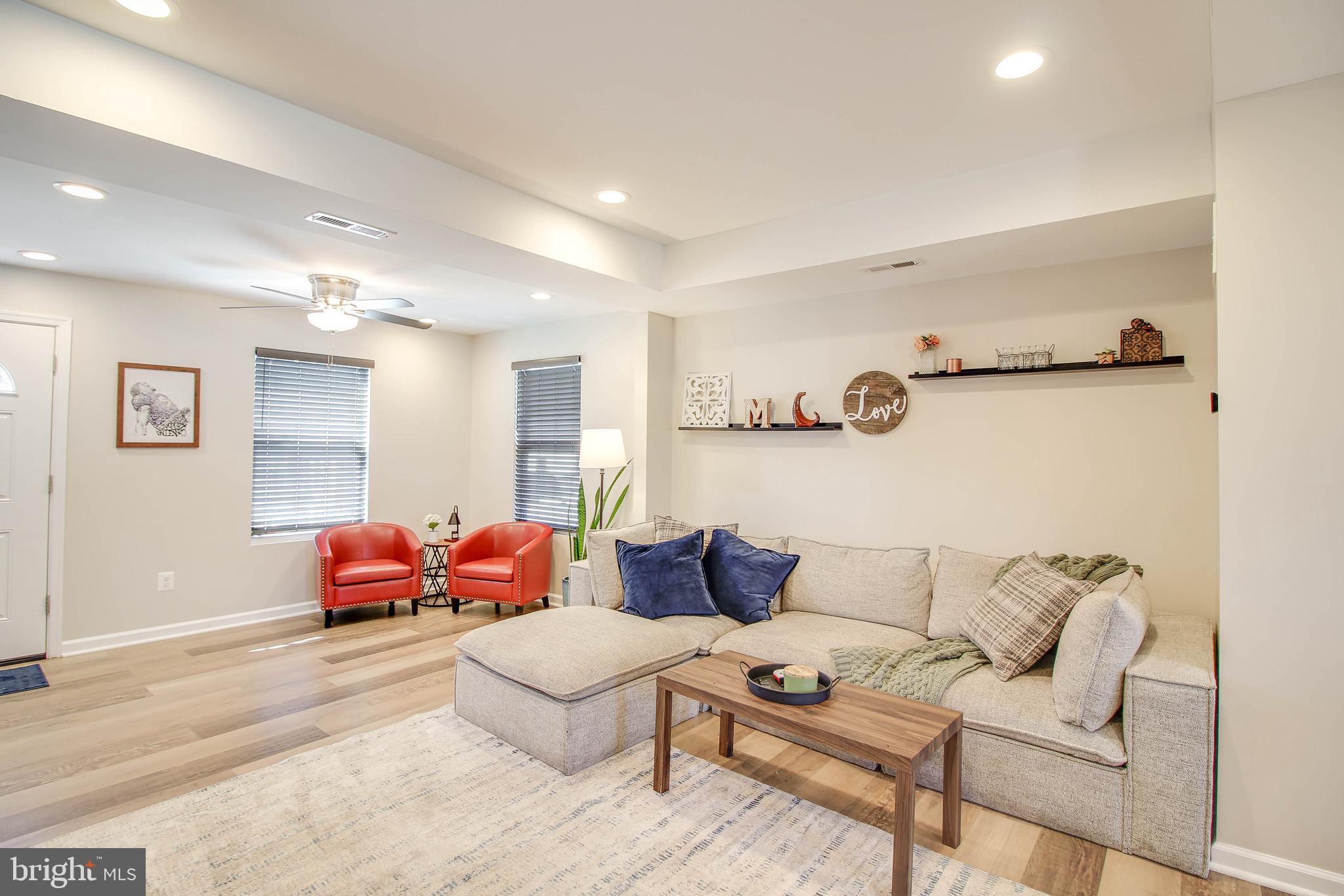 7805 Outing Avenue Pasadena, MD 21122 - Photo 7 of 51 a living room with furniture and a couch