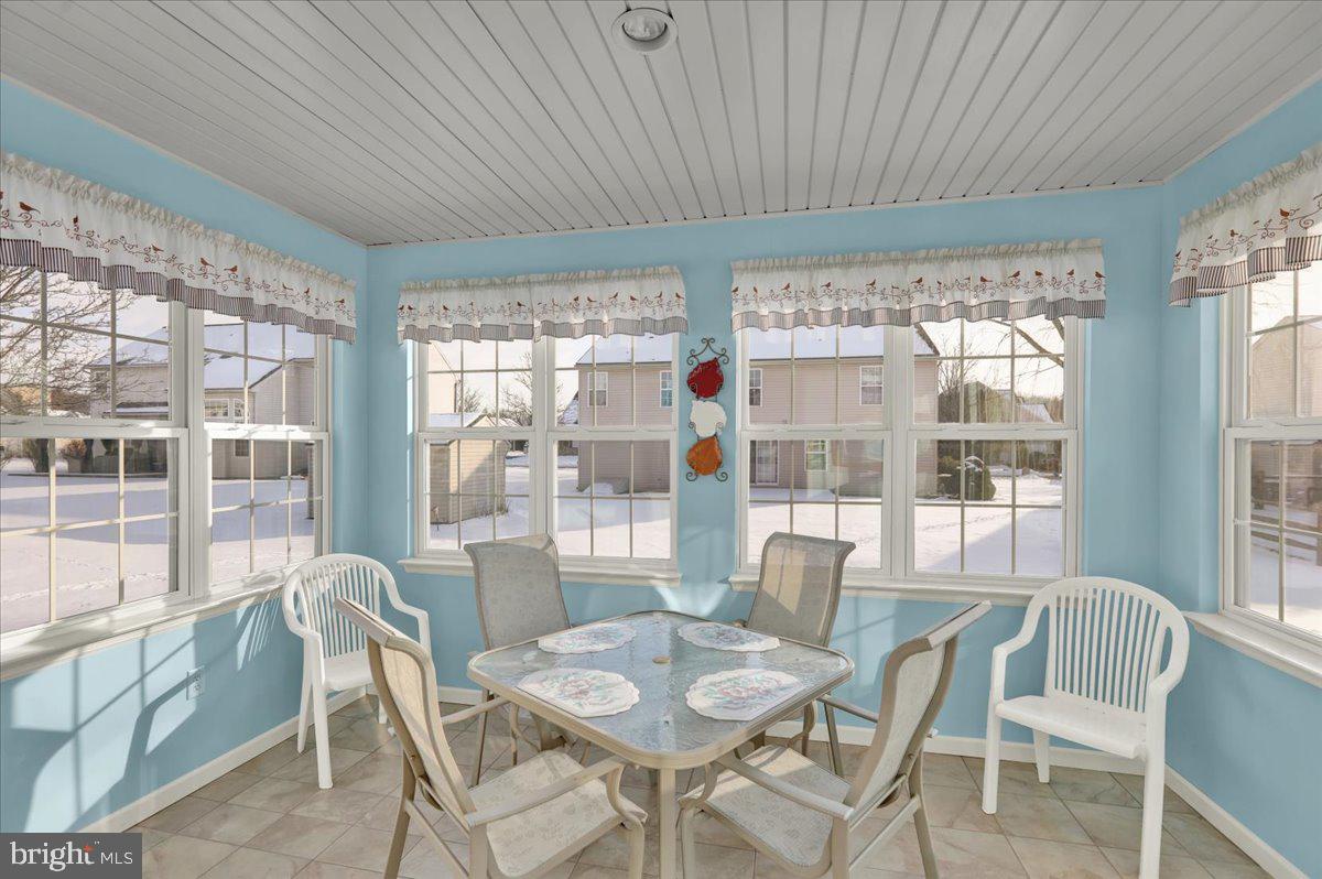 28 Sagebrook Drive Reading, PA 19606 - Photo 15 of 27 a dining room with furniture large windows and wooden floor