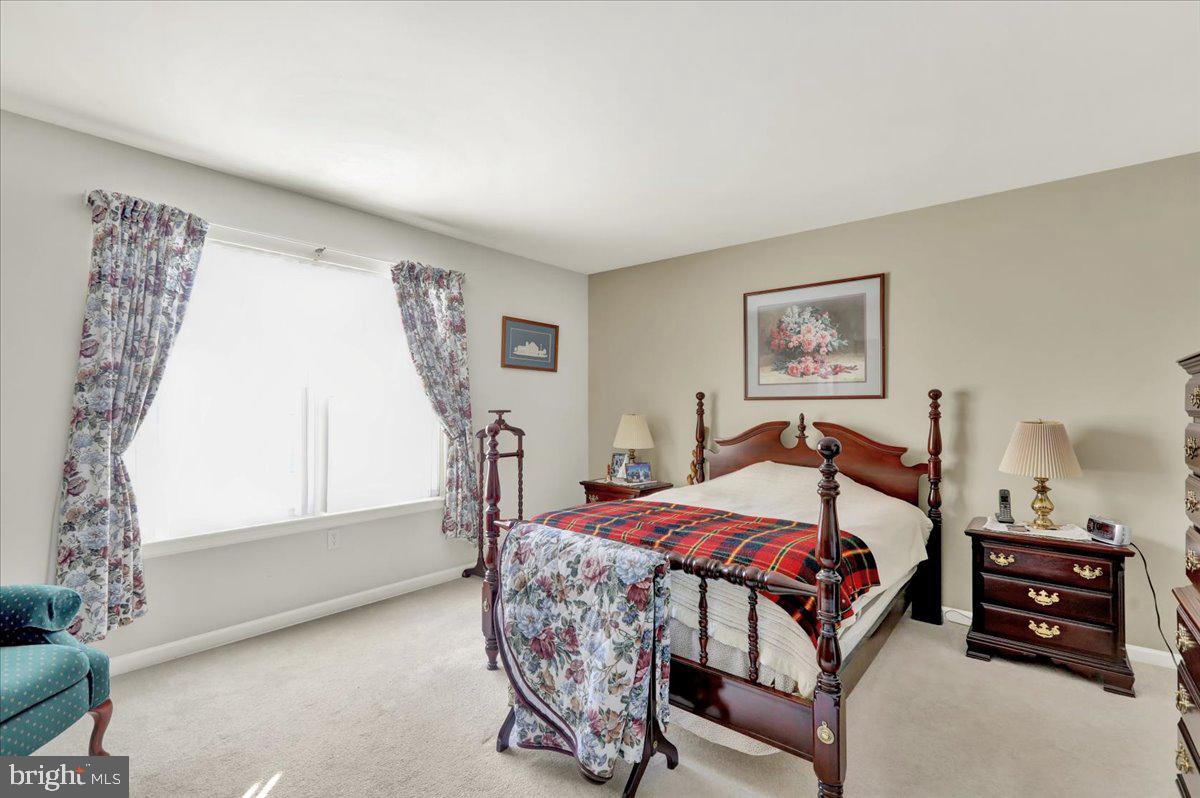 28 Sagebrook Drive Reading, PA 19606 - Photo 17 of 27 a bedroom with a bed and a chandelier