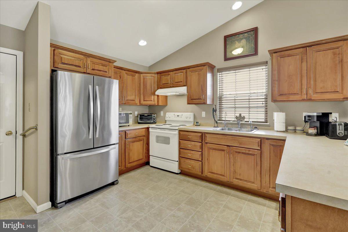 28 Sagebrook Drive Reading, PA 19606 - Photo 10 of 27 a kitchen with granite countertop stainless steel appliances a refrigerator sink and microwave