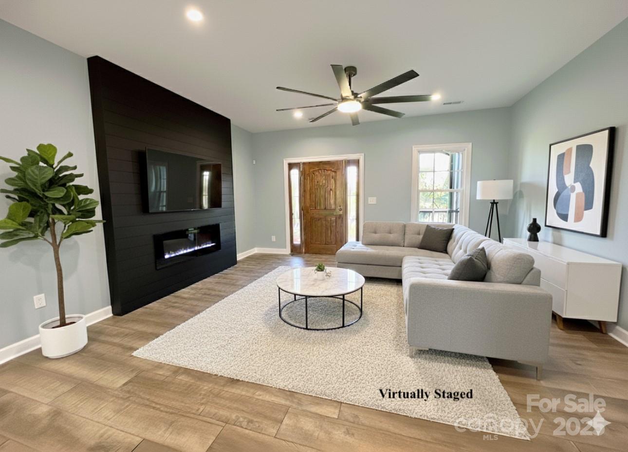 2667 Polo Lane Maiden, NC 28650 - Photo 11 of 36 a living room with furniture potted plant and a window