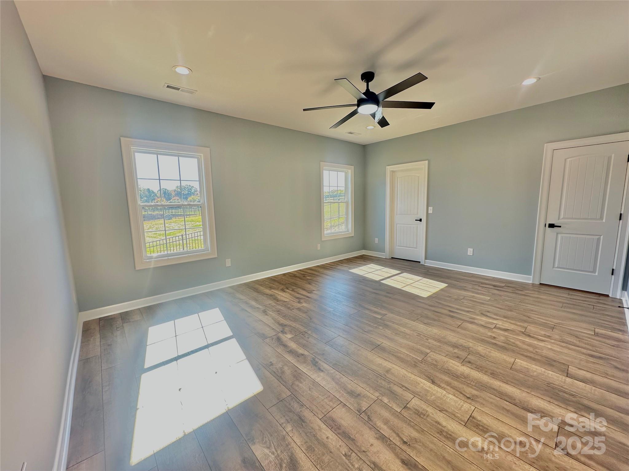 2667 Polo Lane Maiden, NC 28650 - Photo 13 of 36 wooden floor in an empty room with a window