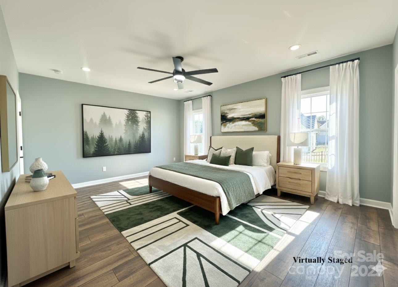 2667 Polo Lane Maiden, NC 28650 - Photo 14 of 36 a bedroom with a bed and a chandelier