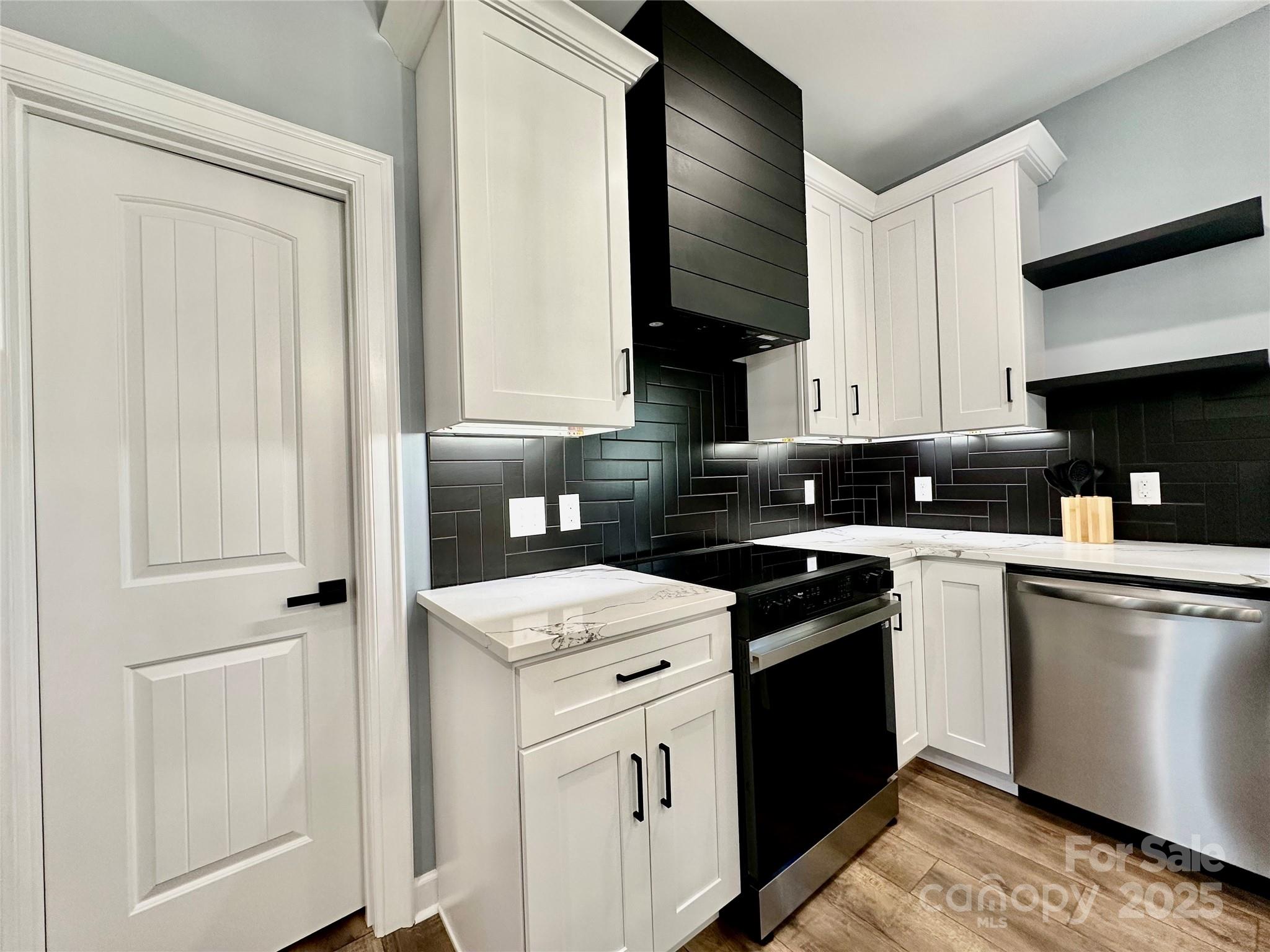 2667 Polo Lane Maiden, NC 28650 - Photo 25 of 36 a kitchen with a sink stove and cabinets