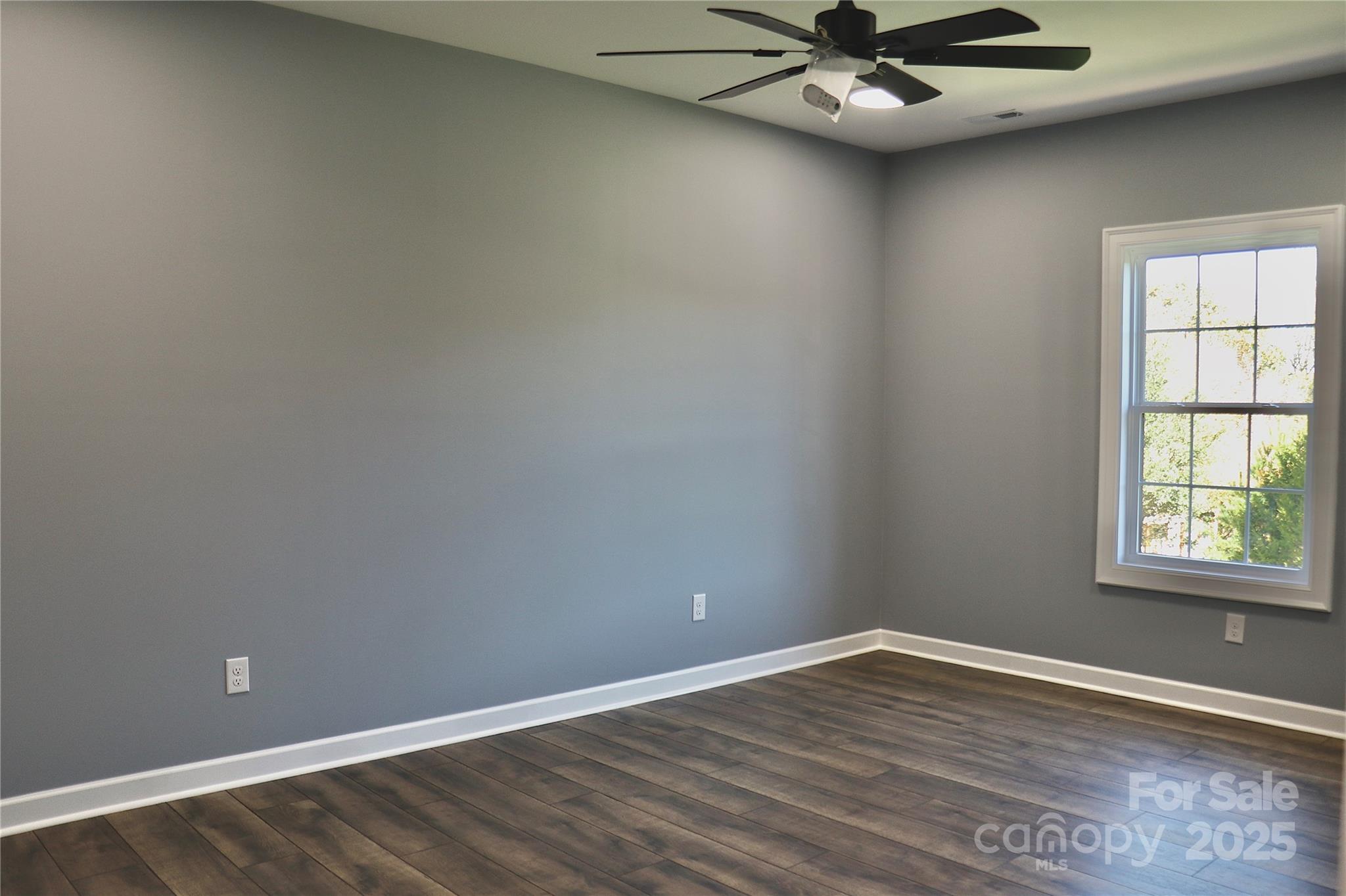 2667 Polo Lane Maiden, NC 28650 - Photo 30 of 36 an empty room with wooden floor and windows