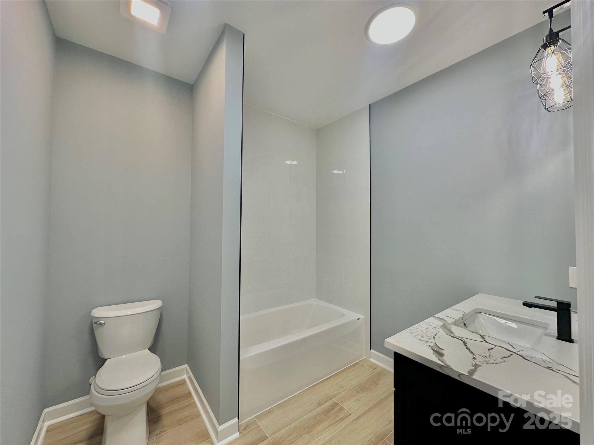 2667 Polo Lane Maiden, NC 28650 - Photo 33 of 36 a bathroom with a granite countertop sink toilet and shower