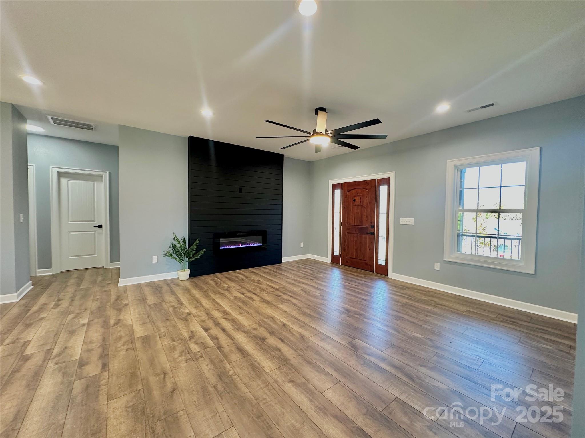 2667 Polo Lane Maiden, NC 28650 - Photo 10 of 36 a view of empty room with wooden floor and fan