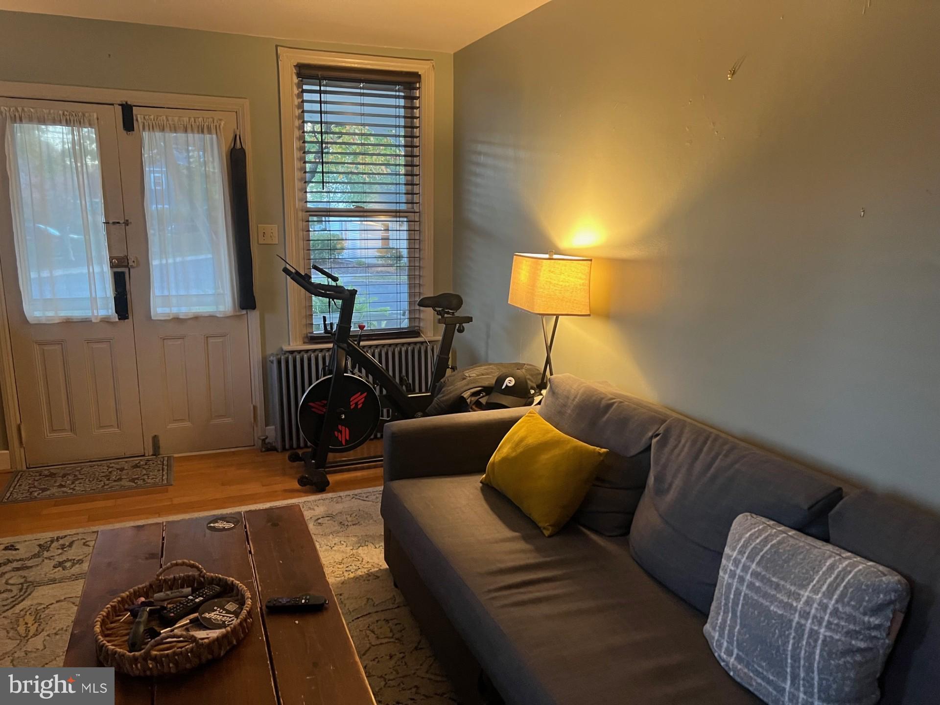 37 North Clinton Street, Unit A Doylestown, PA 18901 - Photo 6 of 11 a living room with furniture and a lamp