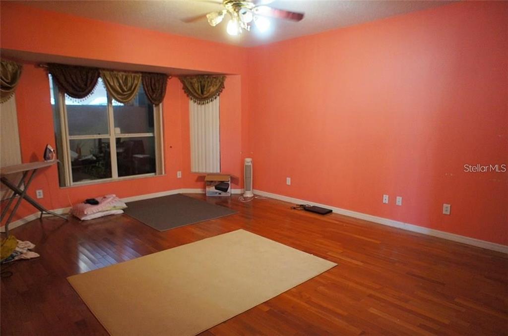 5948 Winchester Isle Road Orlando, FL 32829 - Photo 23 of 23 a view of a room with gym equipment