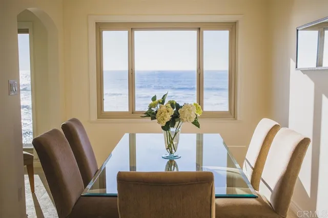 a dining room with furniture and windows