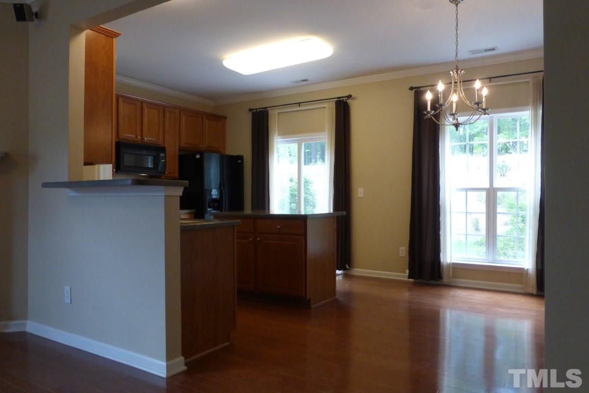 3003 Winding Waters Way Raleigh, NC 27614 - Photo 7 of 17 Wood floors sparkle downstairs.
